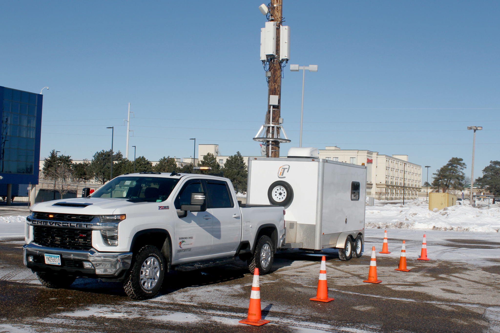 Truck by pole with cones