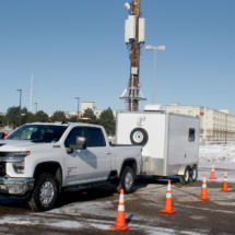 Truck by pole with cones